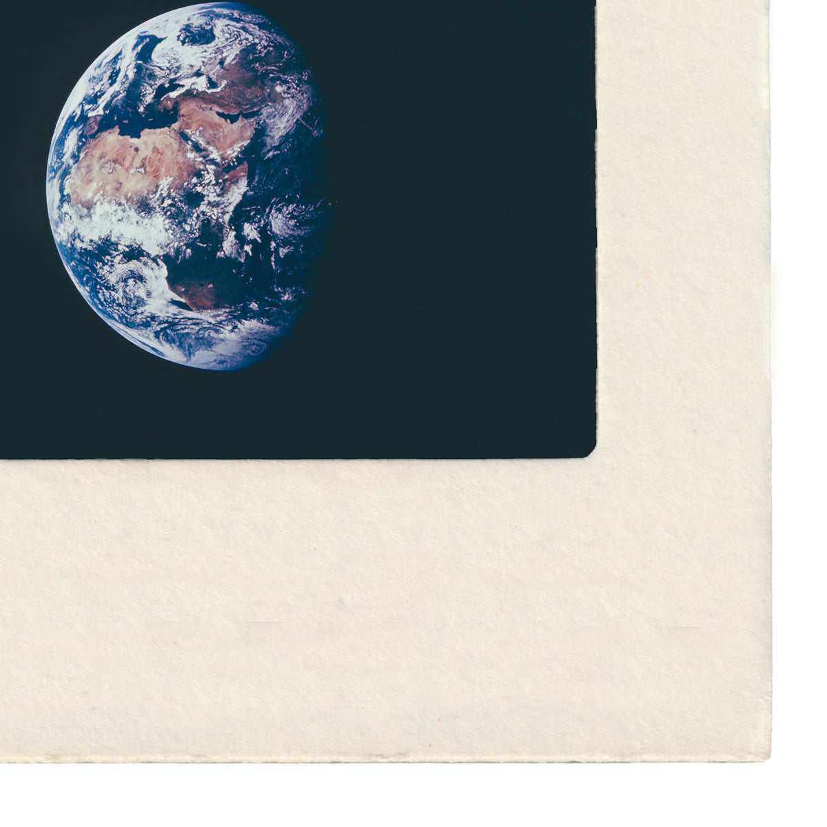Vintage NASA 35mm slide photograph taken from the lunar surface showing Earth rising over the Moon's horizon, captured during the Apollo missions. Printed as a giclée fine art print on archival matte paper.