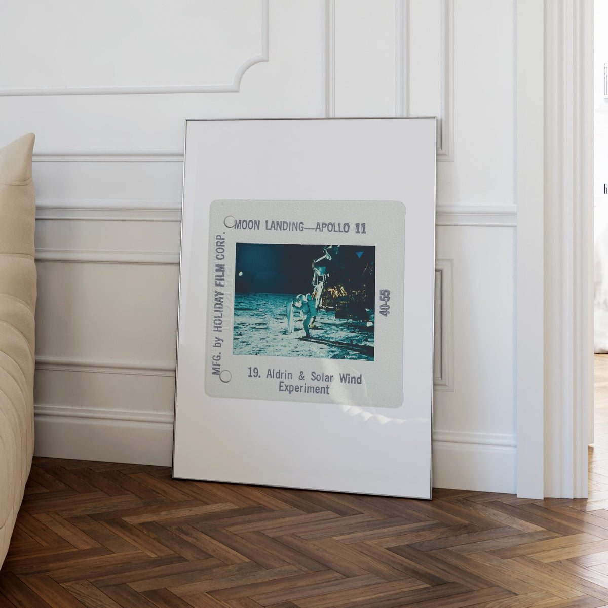 a framed photograph of the Apollo 11 moon landing, with the text "Moon Landing - Apollo 11" and "MFG. BY HOLDAY FILM CORP."