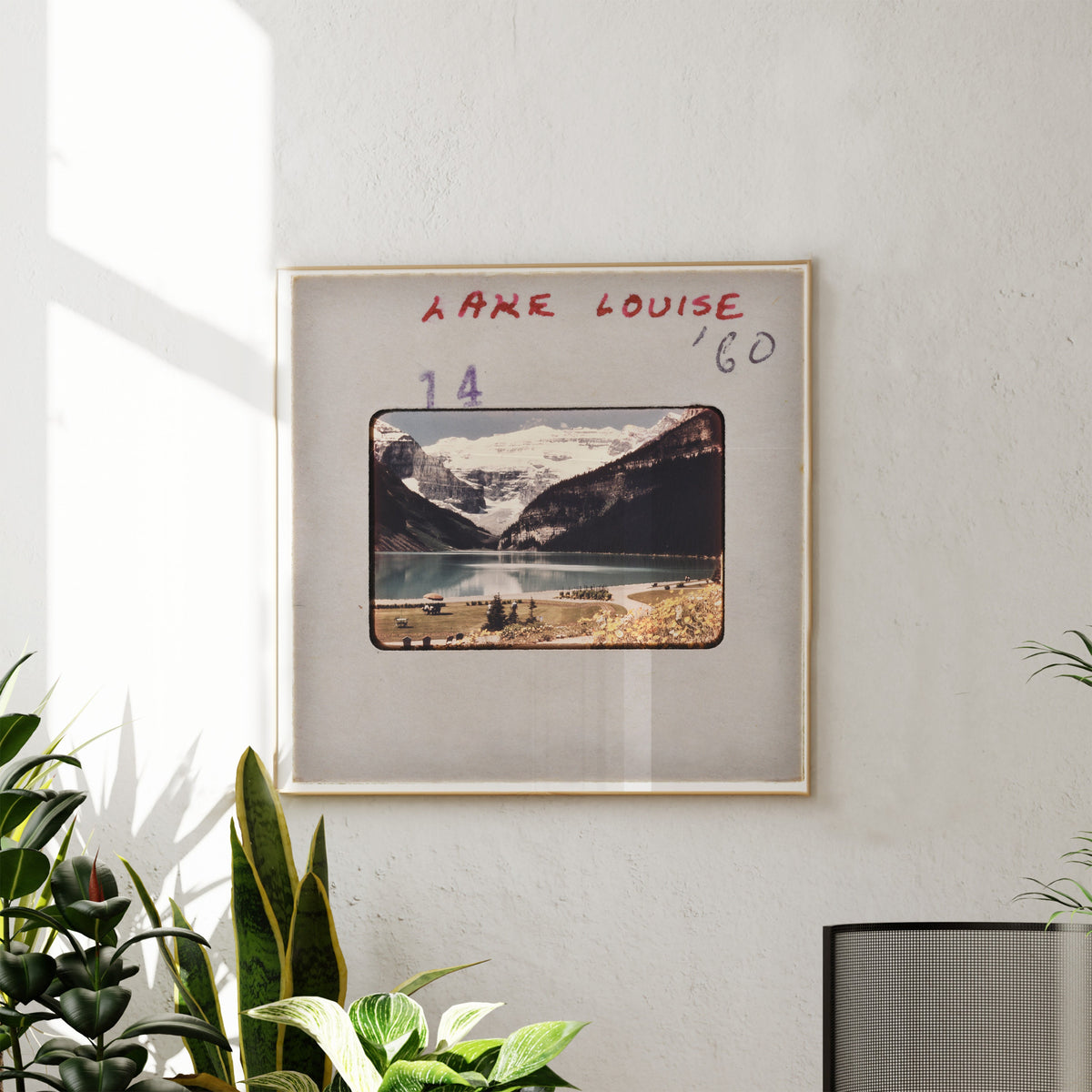 The image is a framed photograph of a scenic mountain landscape, with the name 'LARGE LOUISE' written above it.