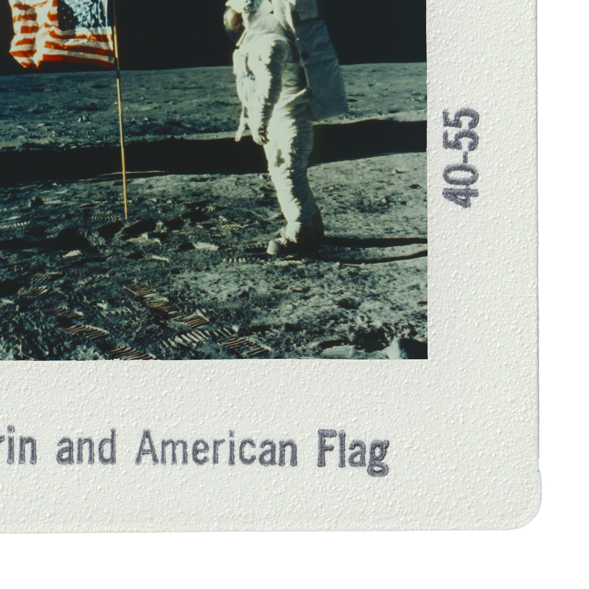 an astronaut walking on the surface of the moon, with an American flag visible in the background.