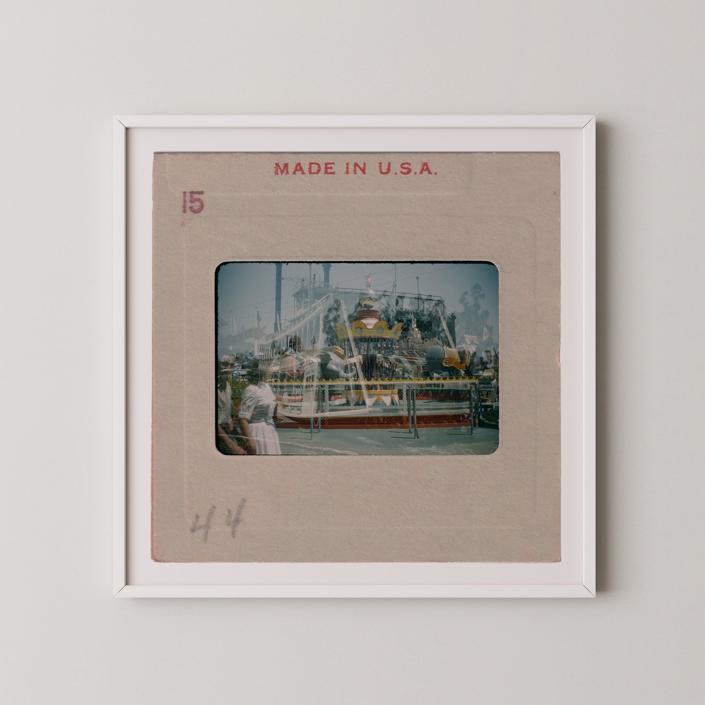 The image is a framed photograph of a carnival ride, with the text "MADE IN U.S.A." printed on the frame.