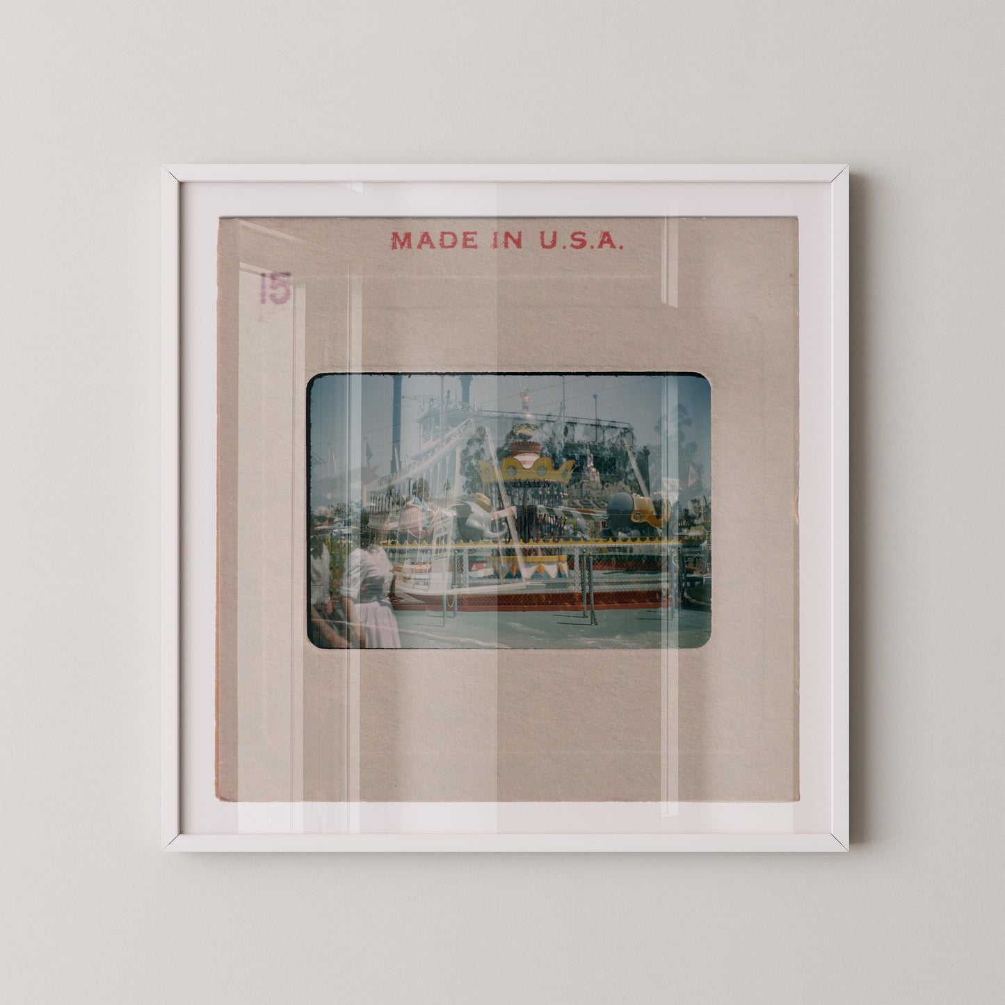 The image is a framed photograph of a carnival ride, with the text "MADE IN U.S.A." displayed above the image.