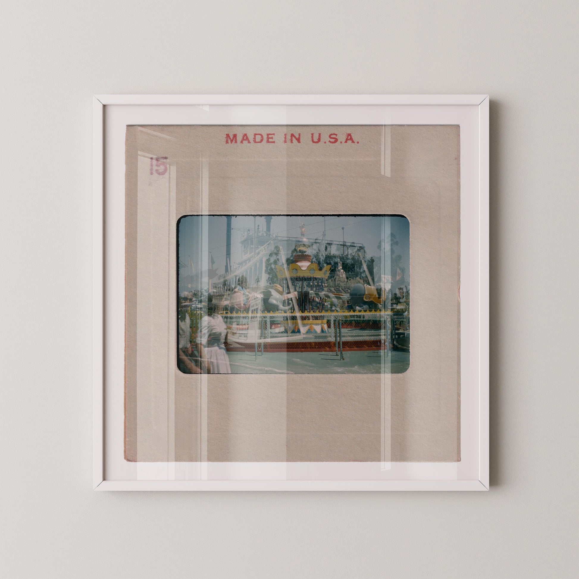 The image is a framed photograph of a carnival ride, with the text "MADE IN U.S.A." displayed above the image.