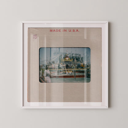 The image is a framed photograph of a carnival ride, with the text "MADE IN U.S.A." displayed above the image.