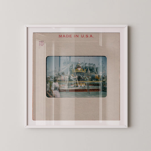 The image is a framed photograph of a carnival ride, with the text "MADE IN U.S.A." displayed above the image.