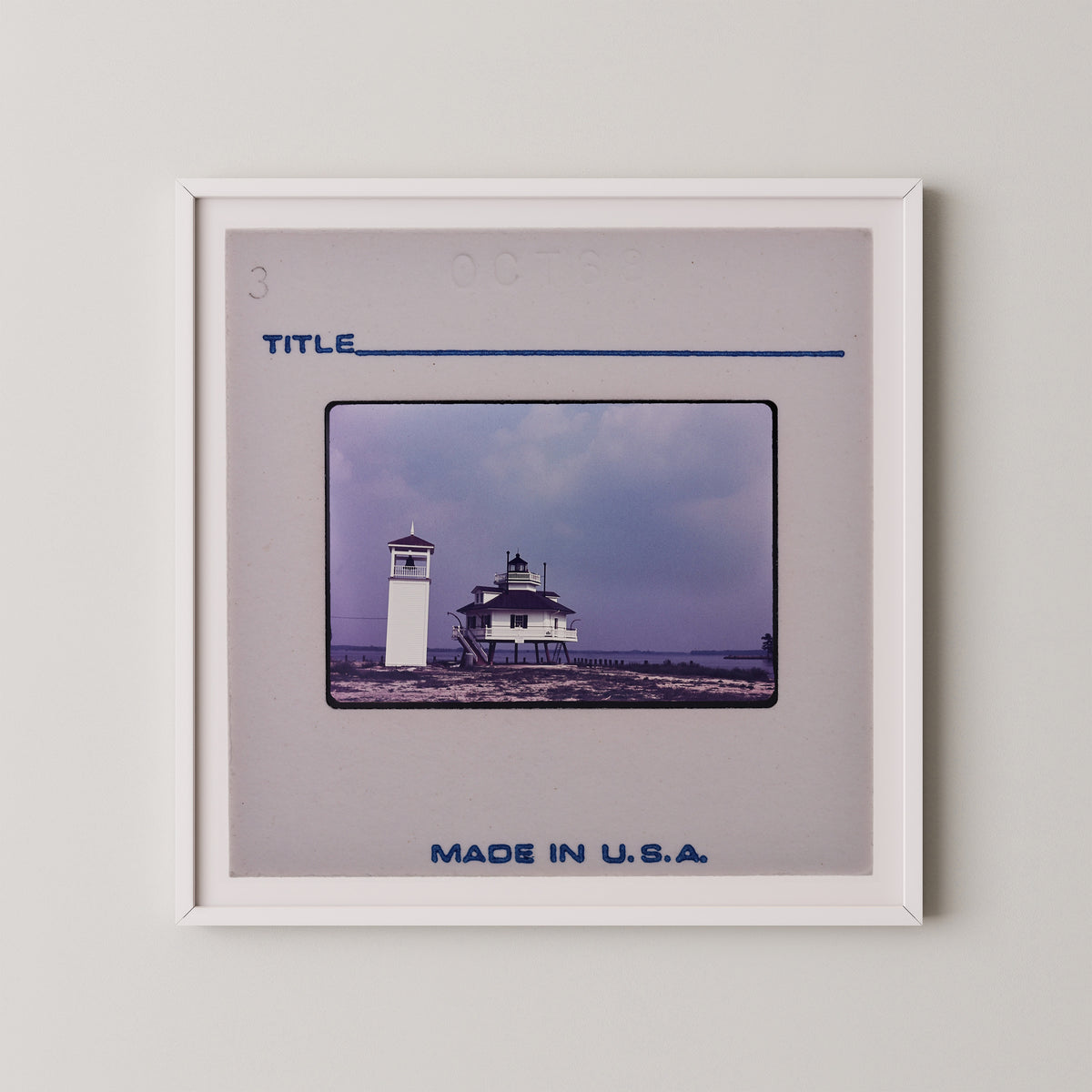 The image is a framed photograph of a lighthouse, with the caption "Title" and "Made in U.S.A."