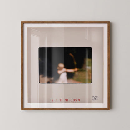 The image is a framed photograph of a person holding a bow and arrow, with the text "Made in USA" visible at the bottom of the frame.