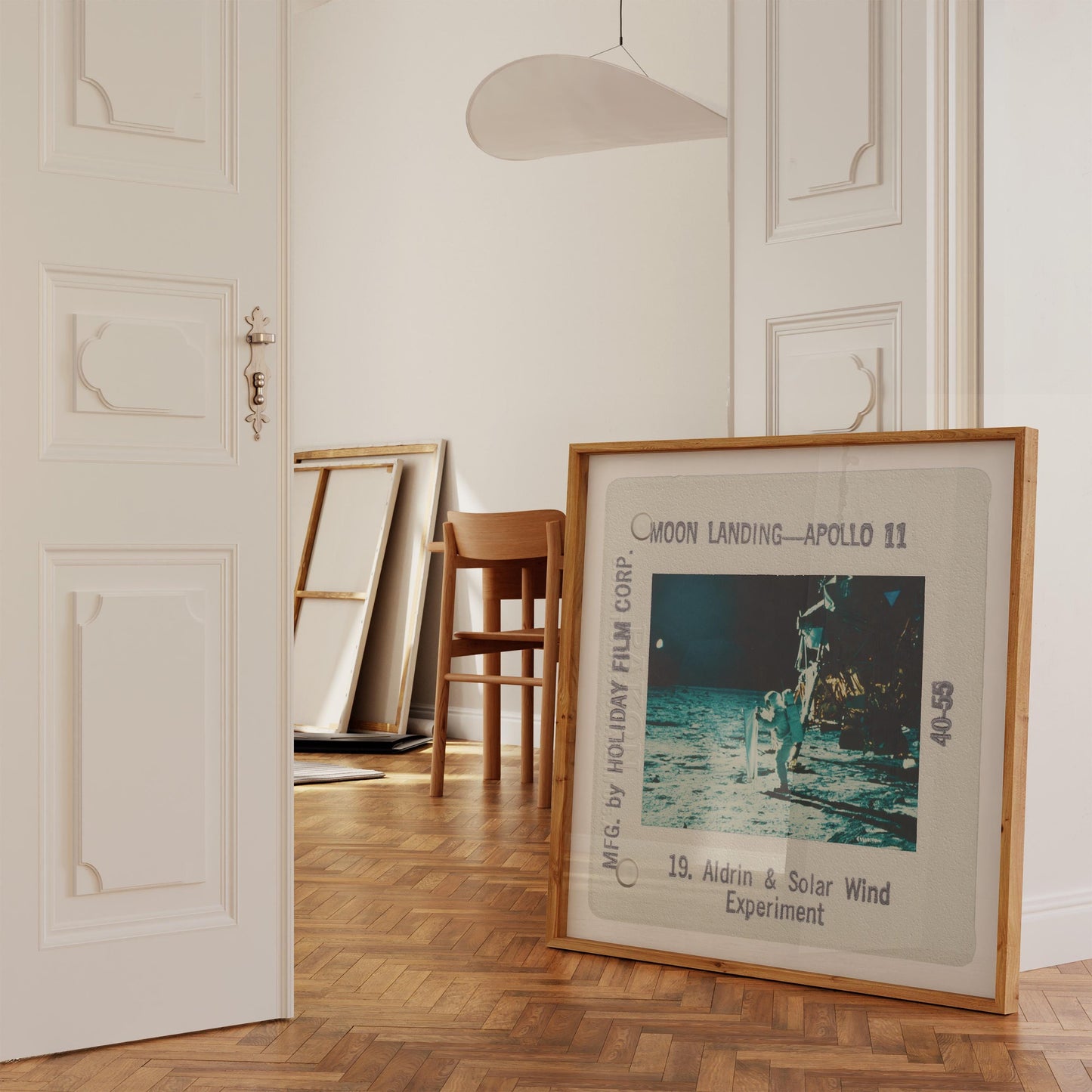 a framed photograph of the Apollo 11 moon landing, with a caption that reads "Moon Landing - Apollo 11".