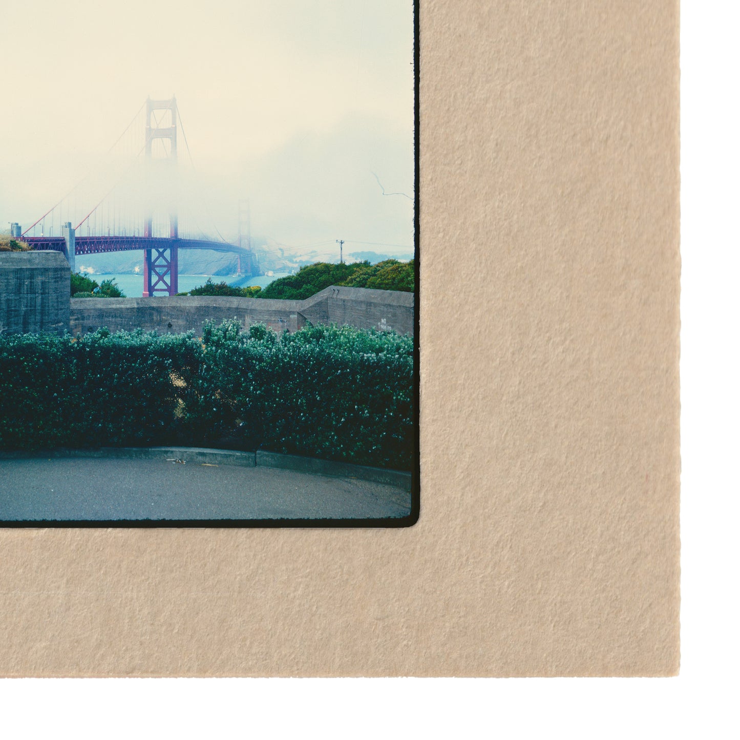 a large suspension bridge with a foggy background, creating a serene and atmospheric scene.