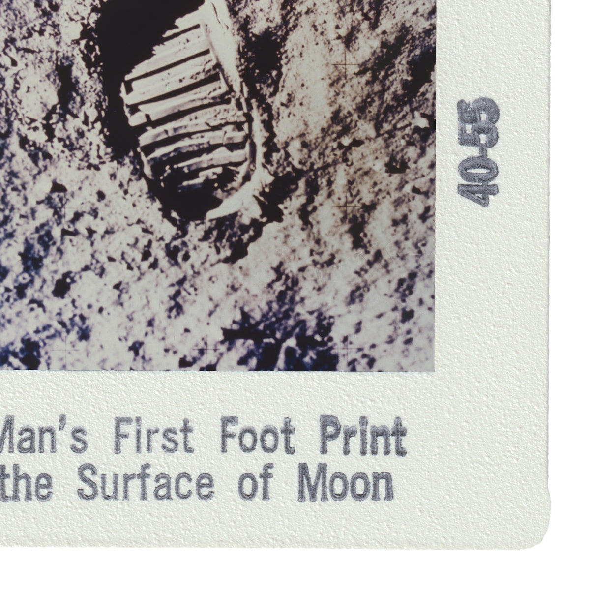 a man's first footprint on the surface of the moon, with the text "Man's First Foot Print" and "Surface of Moon" printed on a white background.