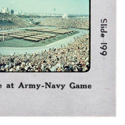 a large crowd of people gathered in a stadium, with rows of people standing in the stands.
