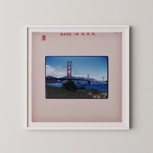 The image is a framed photograph of the Golden Gate Bridge in San Francisco, California.
