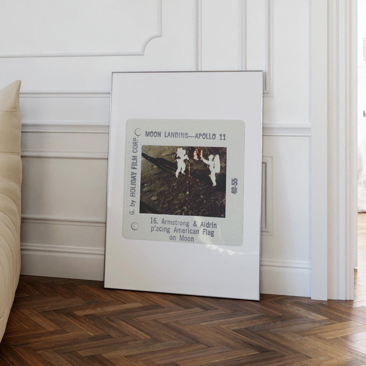 a framed photograph of the Apollo 11 moon landing, with the caption "Moon Landing - Apollo 11" and the names "Armsstrong & Aldrin" and "American Flag" on the bottom.