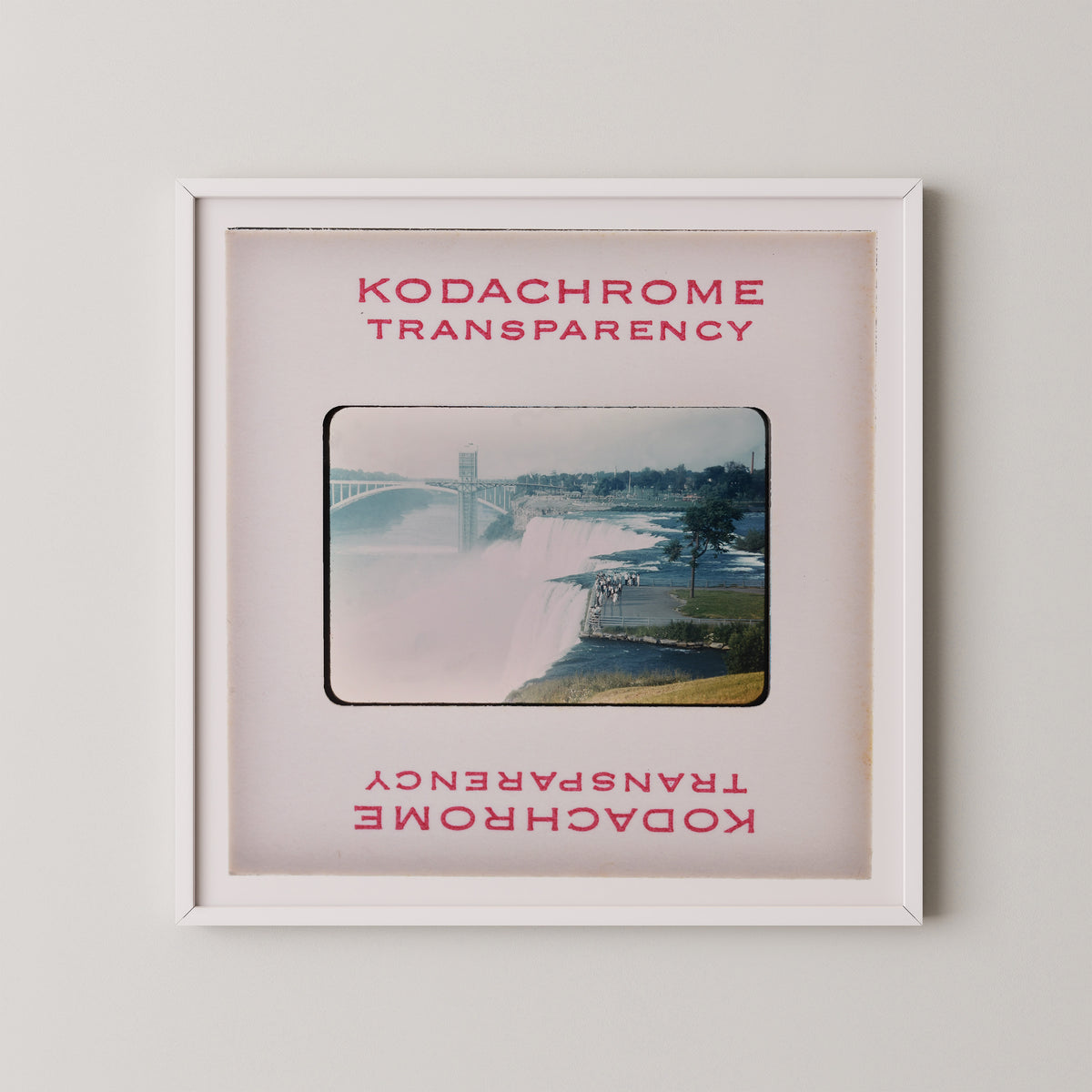 The image is a framed photograph of a waterfall, with the text "KODACHrome Transparency" and "Kodachrome Transparency" repeated in the frame.