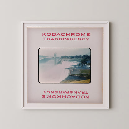 The image is a framed photograph of a waterfall, with the text "KODACHrome Transparency" and "Kodachrome Transparency" repeated in the frame.