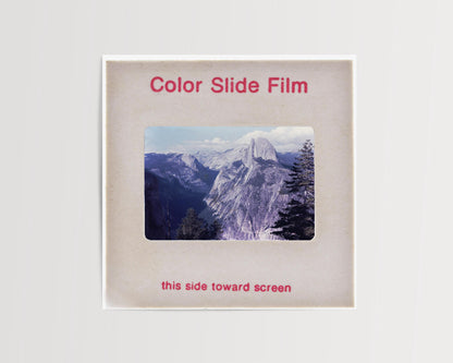 The image is a slide presentation with a photograph of a mountainous landscape, likely a scenic view of a mountain range.