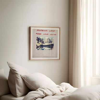 a bedroom with a framed poster of a mountain landscape hanging on the wall above a bed with white bedding.