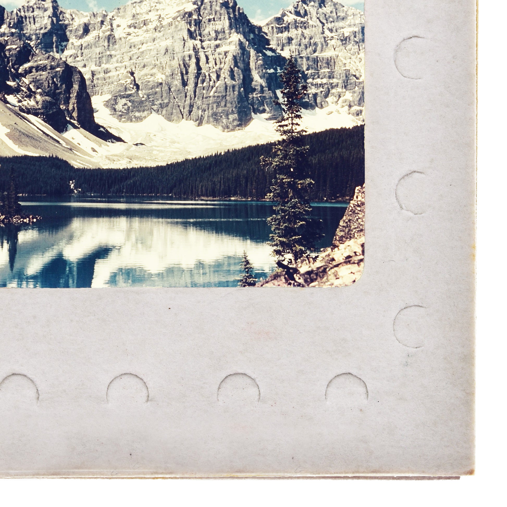 a serene mountain landscape with a calm lake reflecting the surrounding scenery.