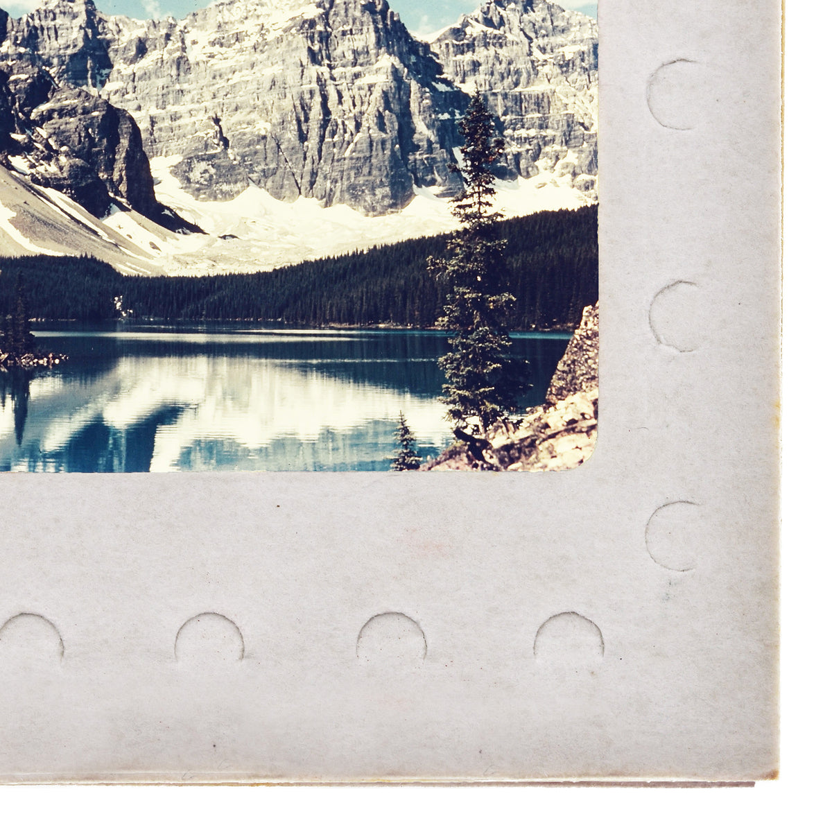 a serene mountain landscape with a calm lake reflecting the surrounding scenery.