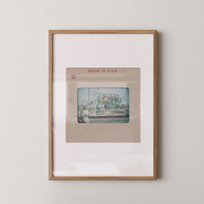 The image is a framed photograph of a building, likely in the United States, with the text "MADE IN U.S.A." printed on the frame.