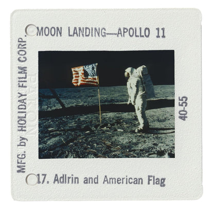 an astronaut standing on the surface of the moon, with an American flag nearby.