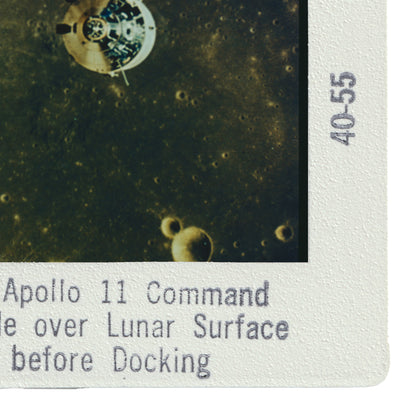a lunar surface with a spacecraft, specifically the Apollo 11 Command and Service Module, floating in the background.