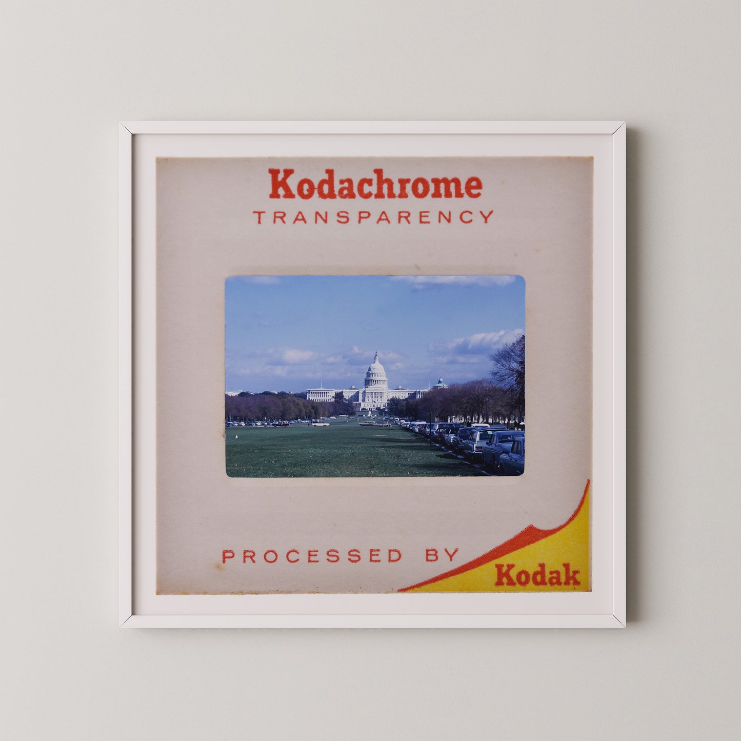 The image is a framed photograph of the United States Capitol building, with the text "Kodachrome transparency" and "Processed by Kodak" printed on it.