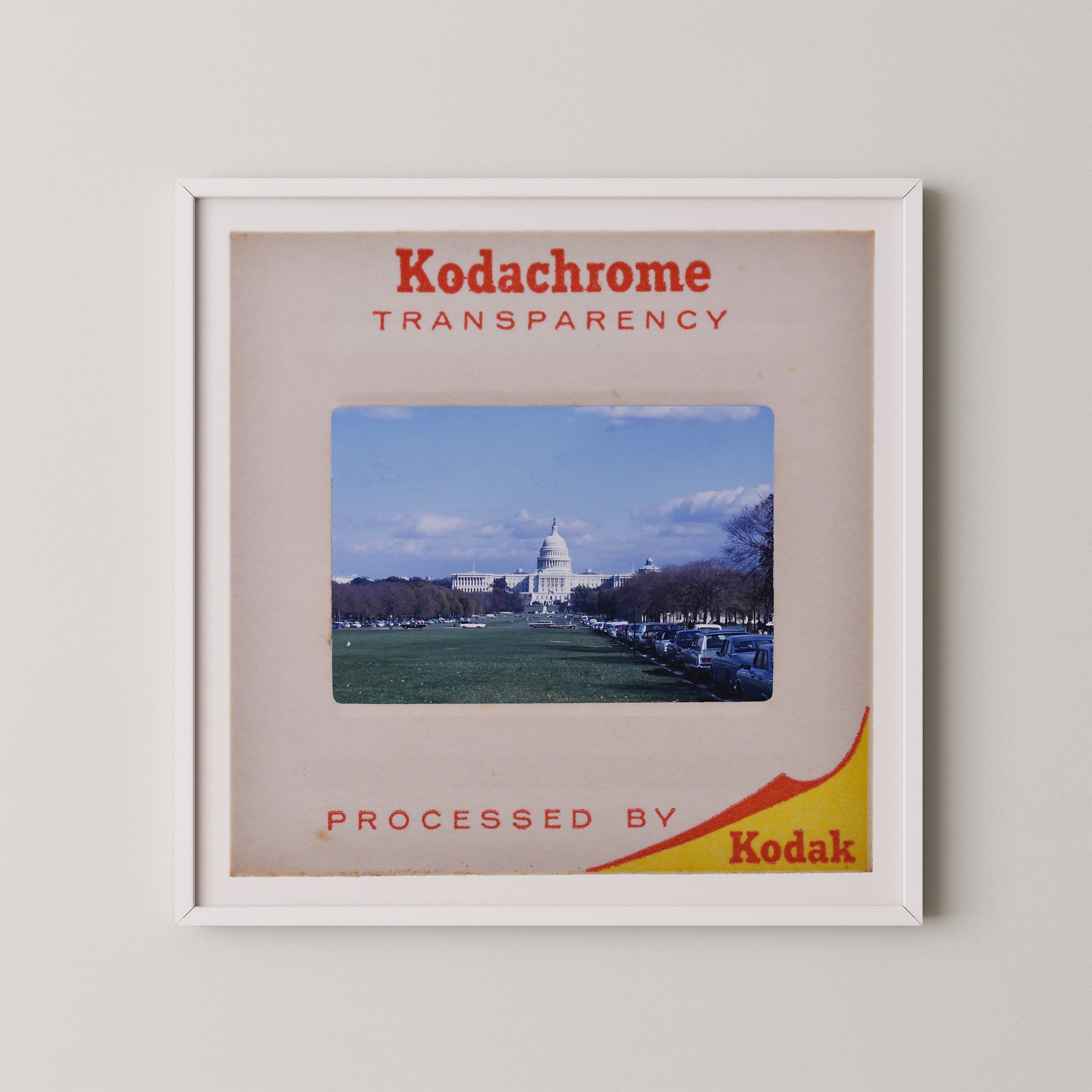 The image is a framed photograph of the United States Capitol building, with the text "Kodachrome transparency" and "Processed by Kodak" printed on it.