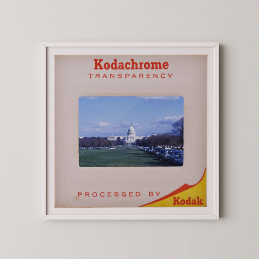 The image is a framed photograph of the United States Capitol building, with the text "Kodachrome transparency" and "Processed by Kodak" printed on it.