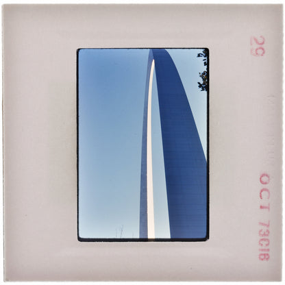 a tall, blue structure with a pointed arch, captured in a photograph.