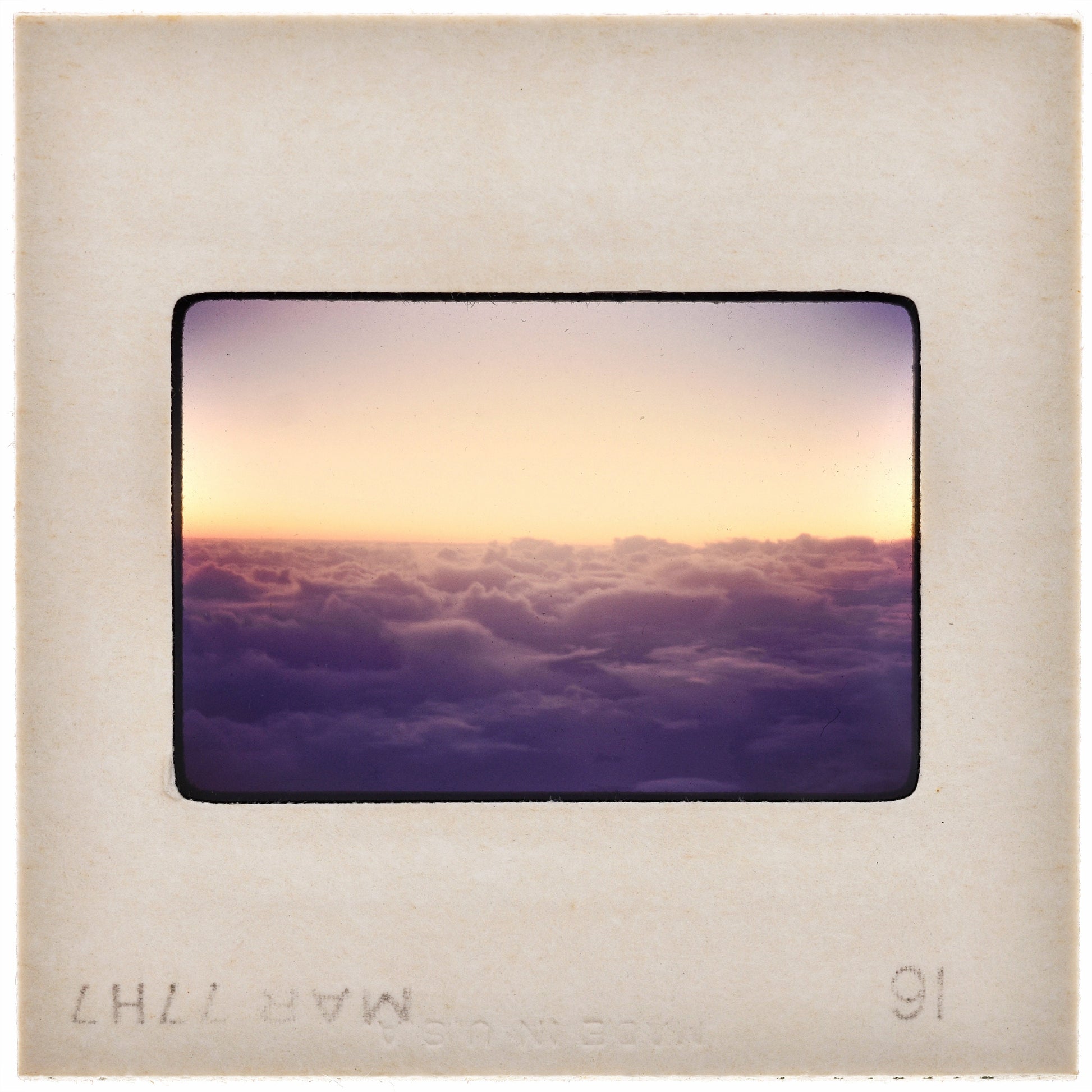 a beautiful sunset over a cloudy sky, with the sun setting behind the clouds.