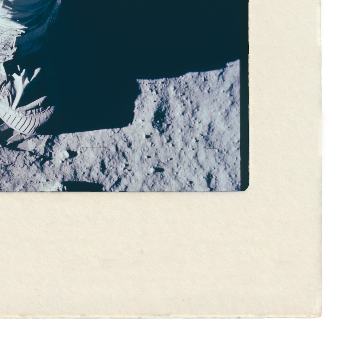 a close-up view of a lunar surface, with visible craters and rocky terrain.