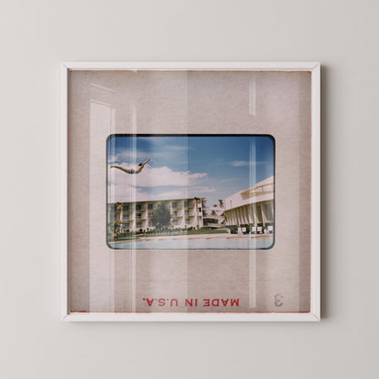 The image is a framed photograph of a building with palm trees, and the text "Made in USA" is visible at the bottom of the frame.