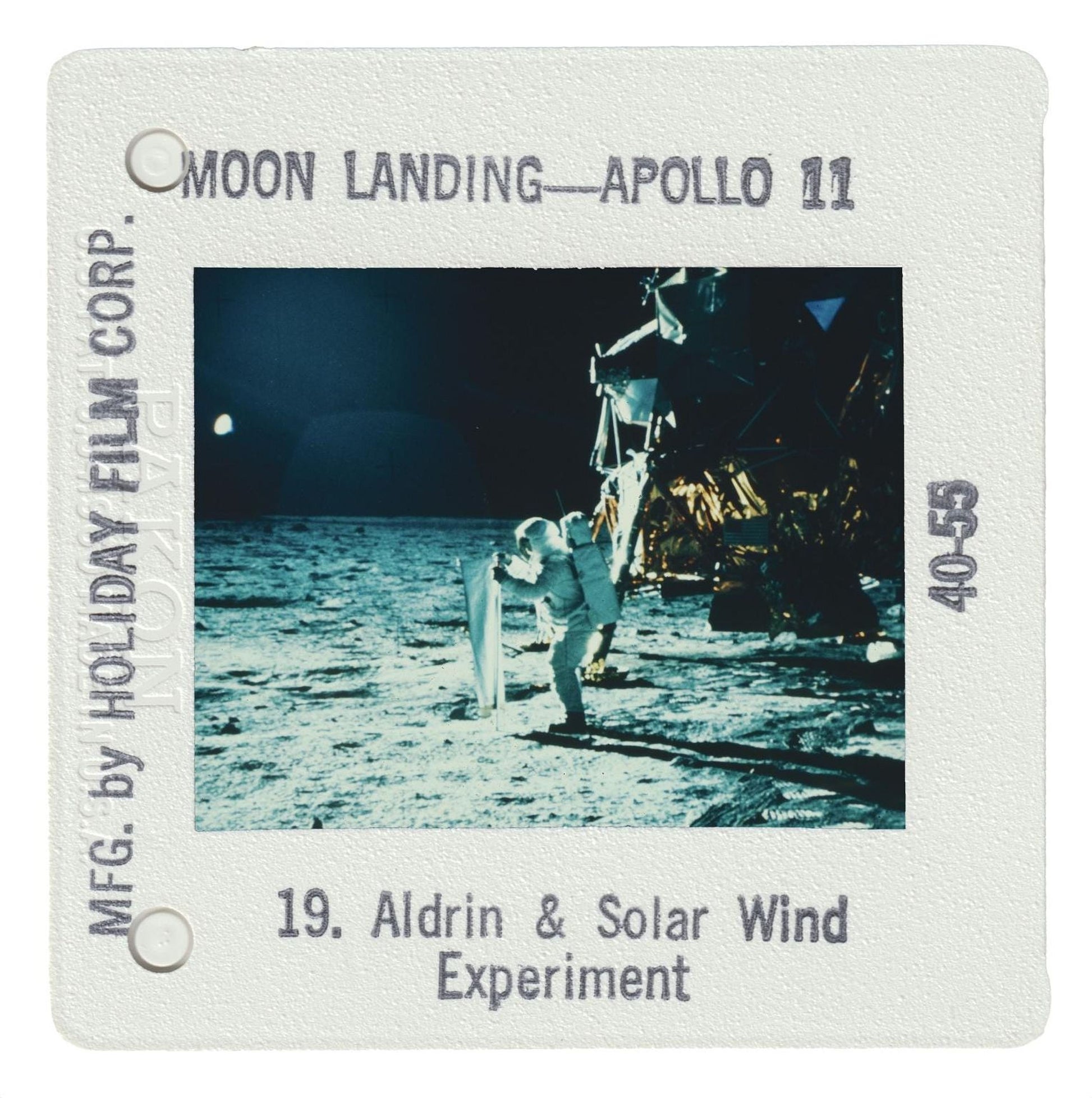 a person in a spacesuit standing on the surface of the moon during the Apollo 11 mission.