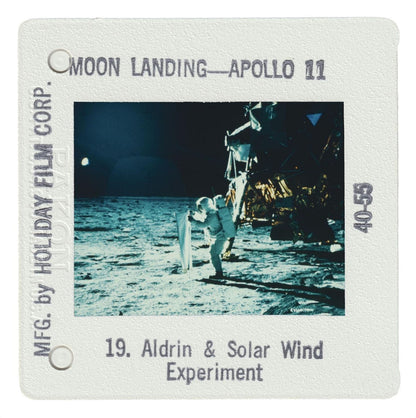 a person in a spacesuit standing on the surface of the moon during the Apollo 11 mission.