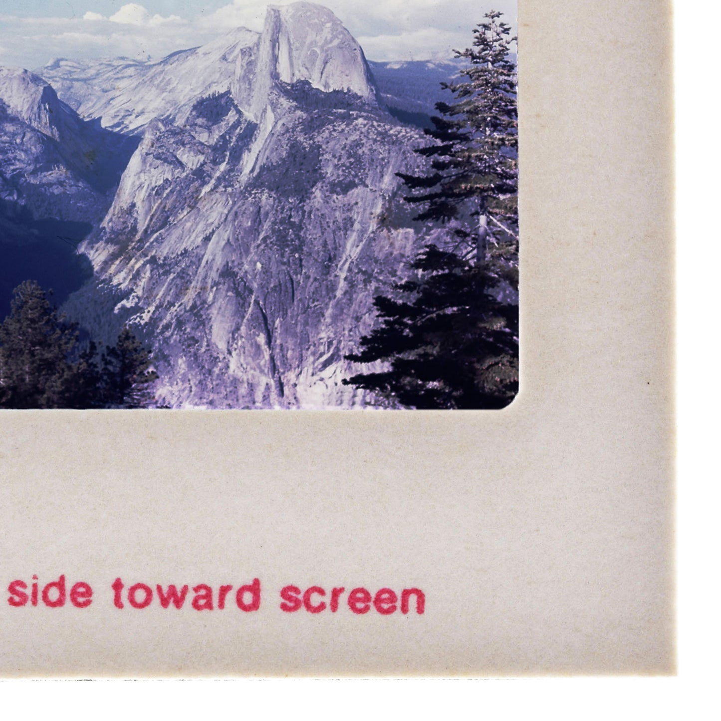 a majestic mountain range with snow-capped peaks and lush green trees.