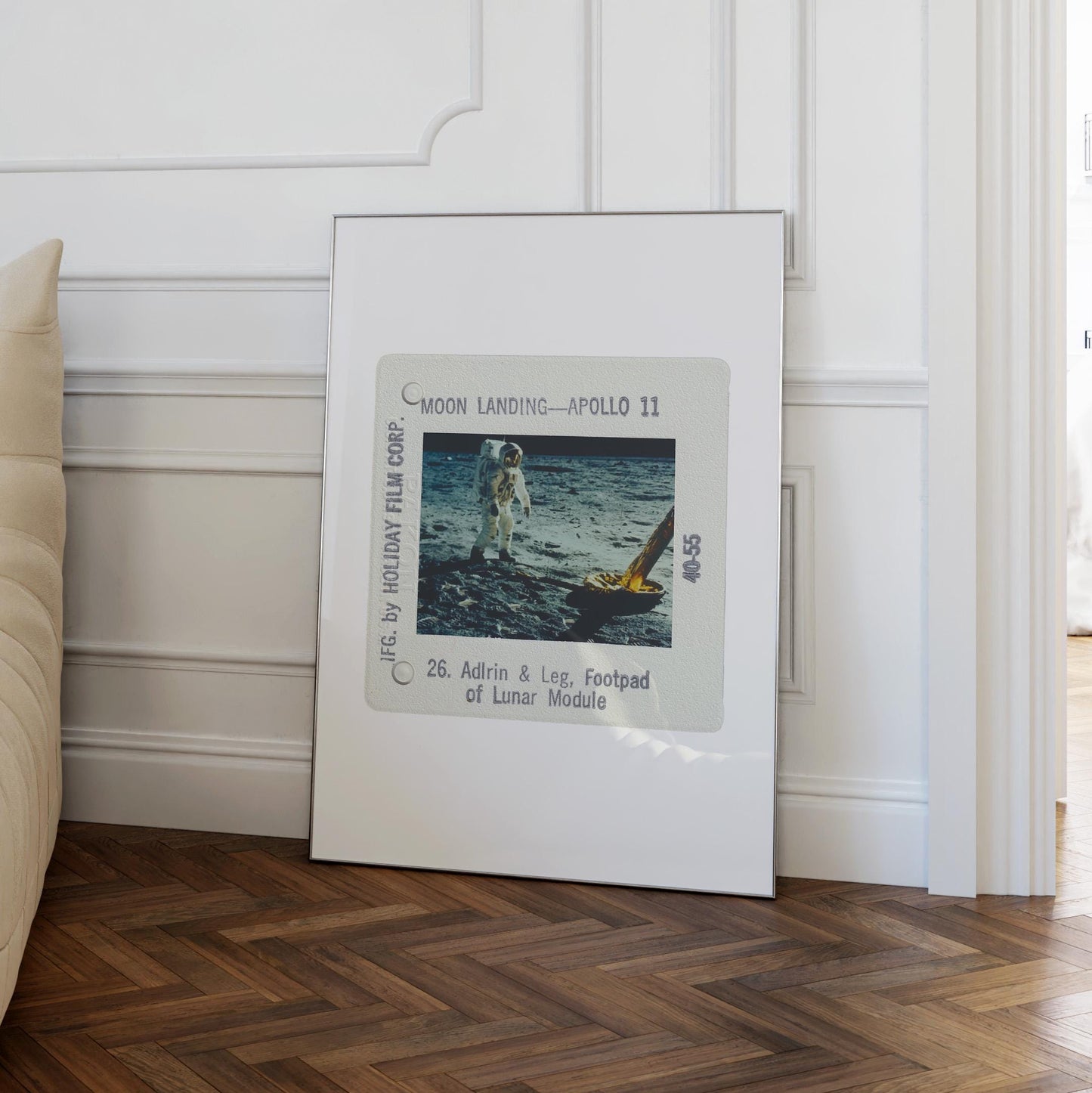a framed photograph of the Apollo 11 moon landing, with the astronaut walking on the lunar surface.