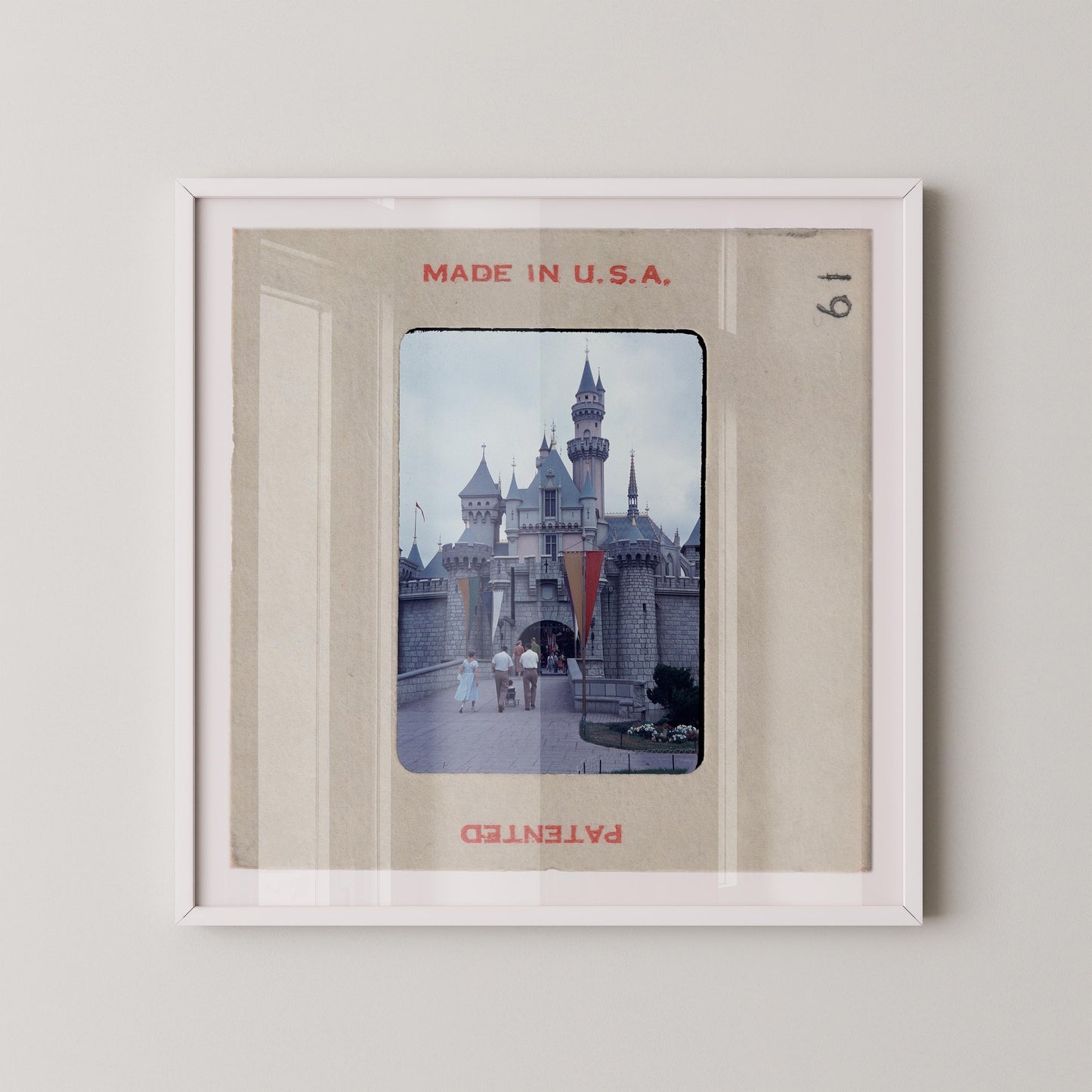 A framed photograph of a castle, with the text "MADE IN U.S.A." at the top and "PATENTED" at the bottom.