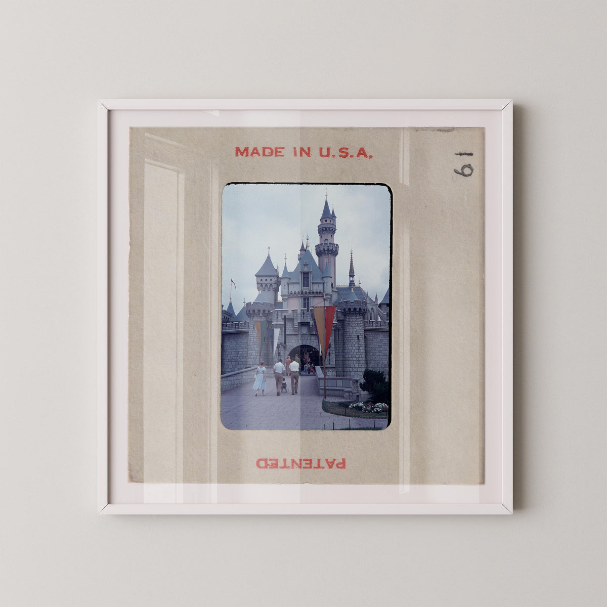 A framed photograph of a castle, with the text "MADE IN U.S.A." at the top and "PATENTED" at the bottom.