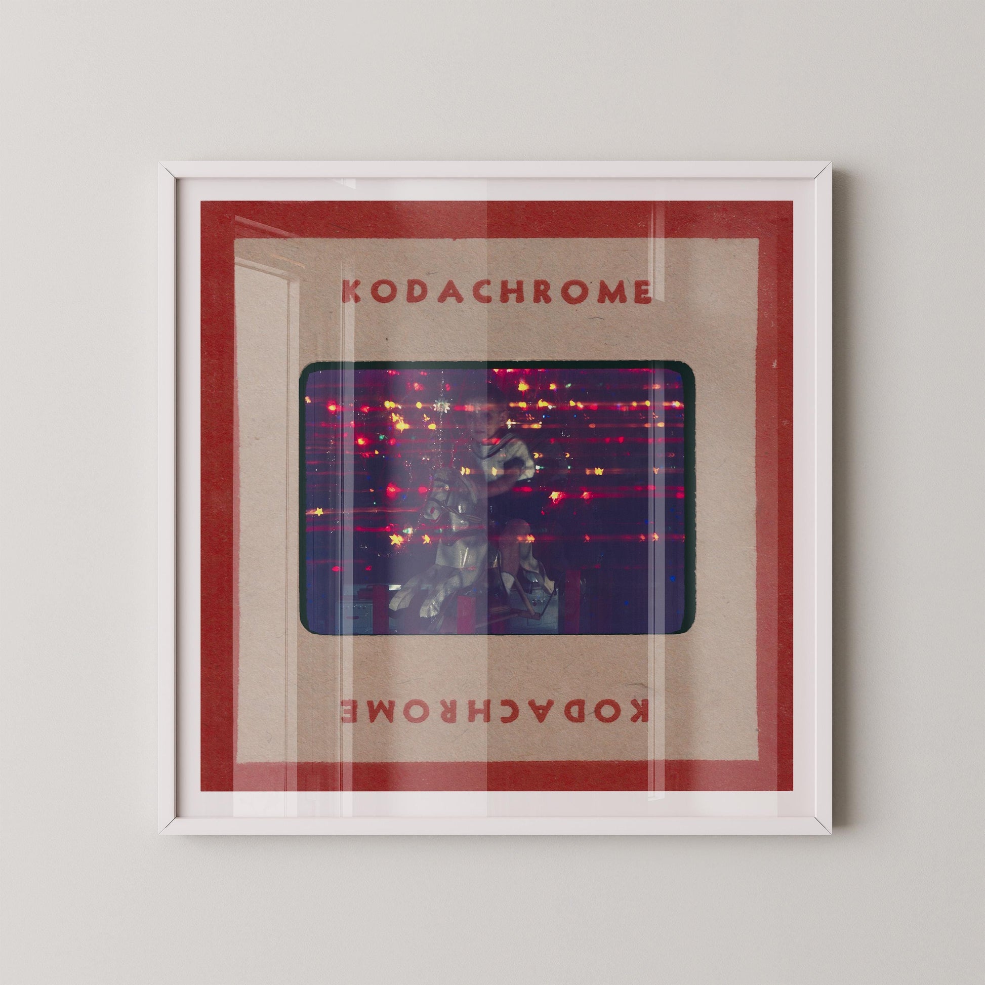 The image is a framed artwork featuring a photograph of a person in a dark room with a red and white color scheme.