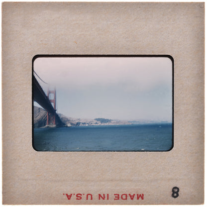 A photograph of the Golden Gate Bridge in San Francisco, California, with a hazy sky in the background.