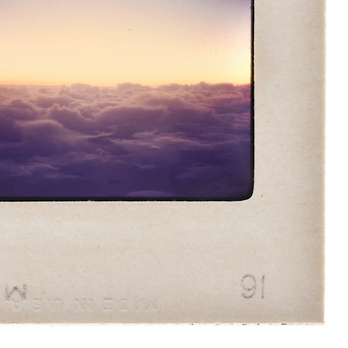 a beautiful sunset over a cloudy sky, with the sun setting behind the clouds.
