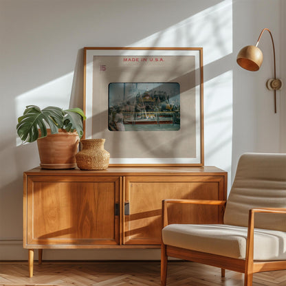 a wooden cabinet with a framed picture of a ship on top, a potted plant, and a woven basket on the cabinet. The cabinet is situated in a room with a chair and a lamp.